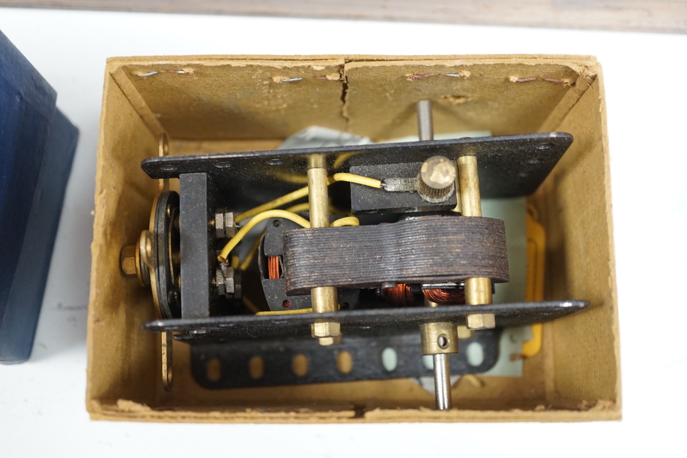 A wooden boxed meccano set and two boxed E20R electric motors